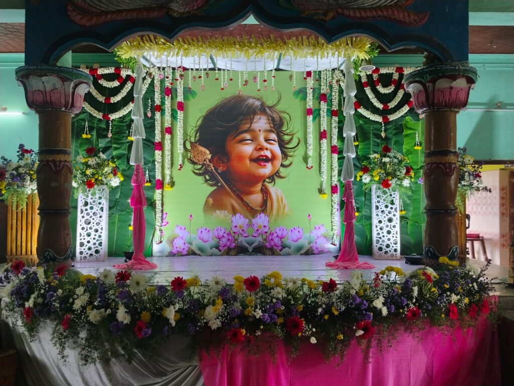 Large baby portrait backdrop with lotus flowers and fresh floral arrangements on stage -Tindivanam, Villuppuram
